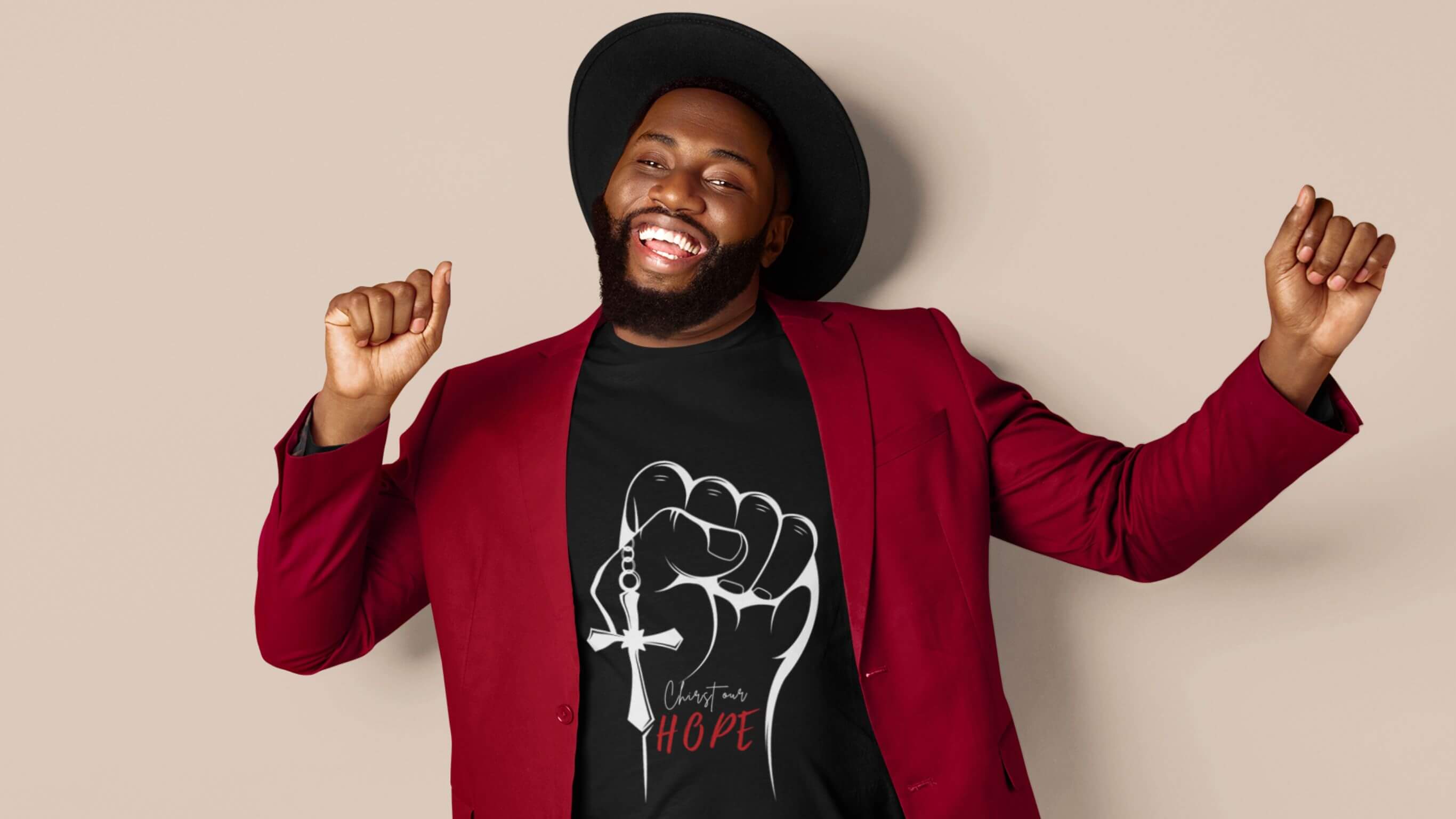 Joyful man celebrating in a black “Christ Our Hope” tee—Ascension Day faithwear collection hero image