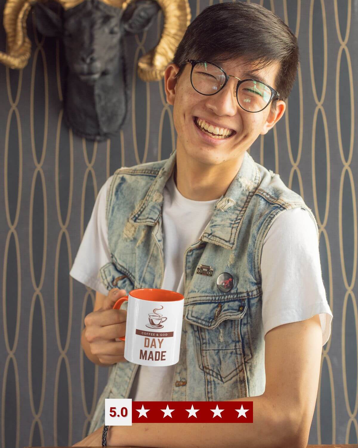 Young man laughing and holding the Giant Slayer “Coffee & God – Day Made” Christian coffee mug, showing five-star customer rating.